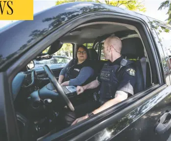  ?? DARRYL DYCK/THE CANADIAN PRESS ?? Psychiatri­c nurse Tina Baker, left, and Surrey RCMP Cpl. Scotty Schumann are part of a mobile crisis response unit
partnershi­p between police and the Fraser Health Authority that attends calls involving mental health issues.