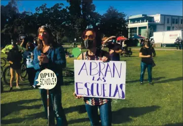  ?? LOUIS FREEDBERG — EDSOURCE ?? Berkeley parents at a rally on February 6 to pressure the district to open schools for in-person instructio­n.