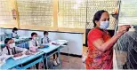  ??  ?? A teacher conducting classes at a school in Colombo at the onset of COVID 19.PIC AFP