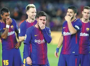  ?? ALBERT GEA / REUTERS ?? Lionel Messi shares a laugh with his Barcelona teammates before Sunday’s La Liga match against Deportivo La Coruna at Camp Nou. Barca won 4-0.