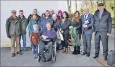  ??  ?? Graham MacQueen, second right, with his wife Morven and son Mark, centre, celebrate outside a local hearing at Oban’s Corran Halls, which agreed to save a hut he built without permission.