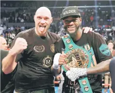  ?? — Reuters photo ?? Deontay Wilder (right) and Tyson Fury after the fight at Staples Centre in Los Angeles, United States.
