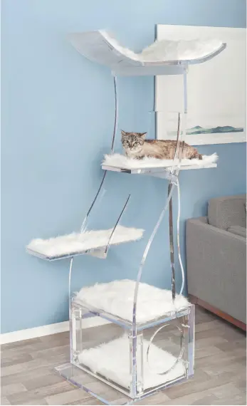  ?? WASHINGTON POST/HANDOUT IMAGES ?? For the pet who deserves nothing but the best, try Refined Feline’s Crystal Clear Lotus Cat Tower, above, which retails for $5,000 US or the Archie & Oscar faux leather Cornelia Dog Sofa, below, which sells for $399.99 US.