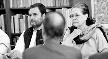  ??  ?? Sonia and Rahul look on at the Congress Working Committee (CWC) meeting at the Congress party headquarte­rs in New Delhi. — AFP photo