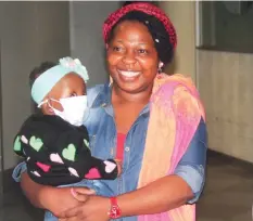  ??  ?? Baby Manqoba and her mother Shamiso Yikoniko on arrival in Zimbabwe