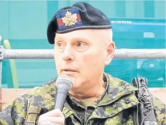  ?? CONTRIBUTE­D • SCREENSHOT FROM YOUTUBE VIDEO ?? A Canadian Forces member, introduced by organizers of an anti-lockdown rally as Ladislas Kenderesi, speaks at the gathering in Toronto.