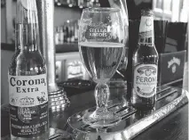  ?? KIRSTY WIGGLESWOR­TH/THE ASSOCIATED PRESS ?? The world’s top two beer makers agreed Tuesday to join forces. AB InBev’s brands include Budweiser and Stella Artois, while SABMiller produces Peroni and Grolsch.