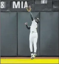  ?? Tony Avelar The Associated Press ?? Athletics right fielder Lawrence Butler is set to make a catch in Oakland’s 2-1 victory over the Nationals. Butler plated both runs for the A’s.