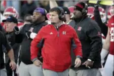  ?? JULIO CORTEZ — THE ASSOCIATED PRESS ?? Rutgers head coach Chris Ash, center, looks on from the sideline during the first half of an NCAA college football game against Michigan, Saturday in Piscataway, N.J.