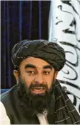  ??  ?? Inzwischen weltberühm­t: Taliban‰Spre‰ cher Zabihulla Mujahid.