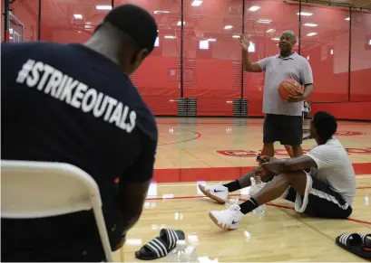  ?? INLAND VALLEY DAILY BULLETIN FILE PHOTOS ?? ALL IN: Team Challenge ALS coach George Mumford speaks with player Deshawn Stephens during a break in practice at Colony High School in Ontario, Calif., on July 10, 2018. Boston College alum Sean Marshall (right) and Team Challenge ALS traveled on Thursday to Ohio to play in The Basketball Tournament in honor of Pete Frates, who suffered from ALS and died in December.