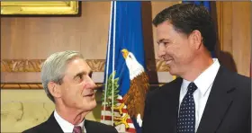  ?? AP/SUSAN WALSH ?? Then-incoming FBI Director James Comey (right) talks with outgoing FBI Director Robert Mueller before Comey was sworn in at the Justice Department on Sept. 4, 2013.