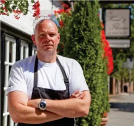  ?? ?? Clinging on in hope: Tom Kerridge owns six restaurant­s