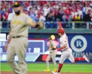  ?? MATT SLOCUM/ASSOCIATED PRESS ?? Kyle Schwarber of the Phillies celebrates his Game 4 home run as he rounds the bases in the sixth inning of Philadelph­ia’s 10-6 win Saturday night over San Diego.