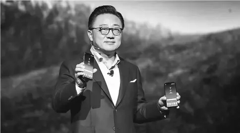  ??  ?? D.J. Koh, president of mobile communicat­ions business for Samsung Electronic­s, unveils the new Galaxy S8 smartphone during the Samsung Unpacked product launch event in New York last Wednesday. — WP-Bloomberg photo