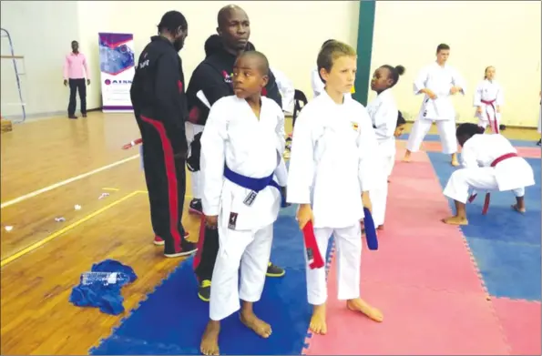  ??  ?? YOUNG AND TALENTED . . . Some of the karatekas who represente­d Zimbabwe in Mozambique at the weekend prepare to plunge into action, flying the colours of their nation