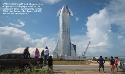  ?? (Loren Elliott/Getty Images/TNS) ?? SPACE ENTHUSIAST­S look at a prototype of SpaceX’s Starship spacecraft at the company’s Texas launch facility in Boca Chica near Brownsvill­e, Texas, in 2019.