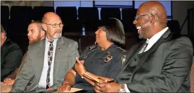  ?? Diane Wagner / Rome News-Tribune ?? Speakers DRC counselor Greg Sanders (from right), Rome Police Chief Denise Downer-McKinney and DRC administra­tor Ken Ward chat before the graduation at North Rome Church of God.