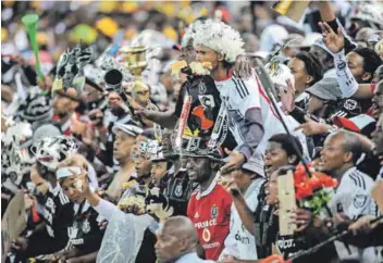  ??  ?? Game on: Pirates fans (above) and assistant coach Rhulani Mokwena (below) are hoping for the Soweto Derby magic they know so well to waft their way this weekend. Photos: Lee