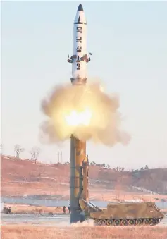  ??  ?? A view of the test-fire of Pukguksong-2 guided by Kim in Pyongyang. — Reuters photo