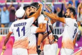  ?? AFP ?? Rupinder Pal Singh (centre) celebrates after scoring against England. India won 43.