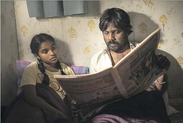  ?? IFC FILMS ?? Winner of the Palme d’Or at the 2015 Cannes Film Festival, Dheepan, the new film from acclaimed director Jacques Audiard, is a gripping, human story of survival involving a Tamil soldier, portrayed by Antonythas­an Jesuthasan, right, posing as a refugee...