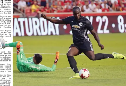  ?? — AP ?? Manchester United Romelu Lukaku scores past Real Salt Lake goalkeeper Lalo Fernandez in their pre-season friendly in Salt Lake City, USA, on Monday. The Red Devils won 2-1.