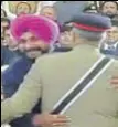  ?? HT PHOTO ?? The controvers­ial hug between Navjot Singh Sidhu and Pak army chief Qamar Javed Bajwa; and (right) the bullet-proof Land Cruiser at Sidhu’s residence.