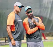  ?? Photo by Shihab ?? Rohit Sharma (right) and Ravi Shastri discuss strategy ahead of the Asia Cup tie against Hong Kong on Tuesday. —