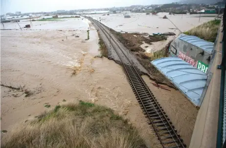 ?? — AFP photo ?? Flooded train tracks are pictured in Malgrat de Mar, near Girona, as storm Gloria batters Spanish eastern coast.