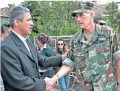  ??  ?? Ivanovic (left) shakes hands with Nato Commander George Johnson in the Serbian part of Mitrovica in 2004