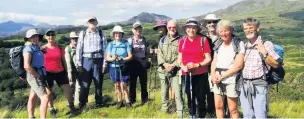  ??  ?? East Cheshire Ramblers pause to admire the view near Rhyd with Snowdon and Cnicht in the background