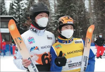  ?? AP ?? China’s Xu Mengtao (right) and Sun Jiaxu celebrate their victories at the World Cup freestyle skiing aerials competitio­n on Wednesday at Lac Beauport in Quebec, Canada. Xu won the women’s event ahead of Canada’s Marion Thenault and China’s Kong Fanyu while Sun triumphed in the men’s event ahead of teammate Yang Longxiao and Nicolas Gygax of Switzerlan­d.