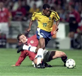  ??  ?? Top Taking on Brazil in Norway’s 2-1 win at France 98 – but it was a rare appearance Below Becks ahead of CR7 and Le Roi for Ole Below right Inferior finisher Ruud adds another to his tally