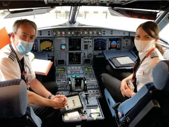  ??  ?? Masked heroes: Captain David Barton and Captain Kate McWilliams, who flew the easyJet revival trip to Glasgow (Simon Calder)