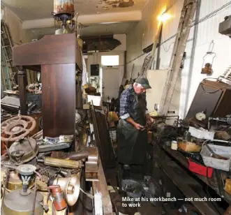  ??  ?? Mike at his workbench — not much room to work