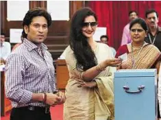  ?? PTI ?? Star attraction Cricketer and Rajya Sabha member Sachin Tendulkar and actress-MP Rekha cast their votes.