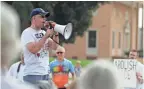  ??  ?? Steve Friday, a Democrat running for Congress, speaks Saturday at a Jackson, Mich., protest.