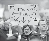  ?? JASPER COLT, USA TODAY ?? A woman at the Women’s March on Washington holds a sign alluding to the campaign of Hillary Clinton, one day after the inaugurati­on of Donald Trump.