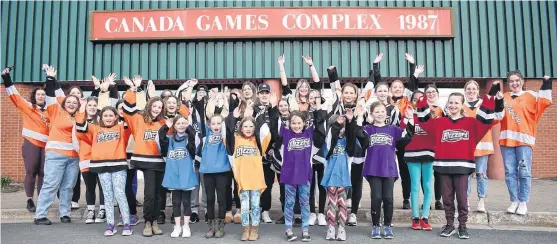  ?? JEREMY FRASER • CAPE BRETON POST ?? Members of the Cape Breton Blizzard Female Hockey Associatio­n and the Cape Breton Capers women’s hockey team cheer in front of the Canada Games Complex on Wednesday to encourage the Cape Breton community to vote for their Kraft Hockeyvill­e bid on Friday. The Canada Games Complex is one of four arenas across Canada vying for the right to be Kraft Hockeyvill­e.