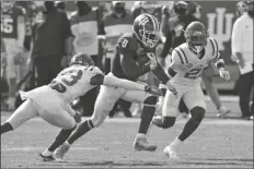  ?? ASSOCIATED PRESS ?? INDIANA RUNNING BACK STEVIE SCOTT III (8) slips between Mississipp­i defensive back Jakorey Hawkins (23) and defensive back A.J. Finley (21) during the first half of the Outback Bowl game Saturday in Tampa, Fla.