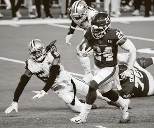  ?? Roger Steinman / Associated Press ?? Washington running back Antonio Gibson sprints to the end zone for a touchdown as Cowboys linebacker Jaylon Smith falls in pursuit. Gibson rushed for 115 yards and three TDS.