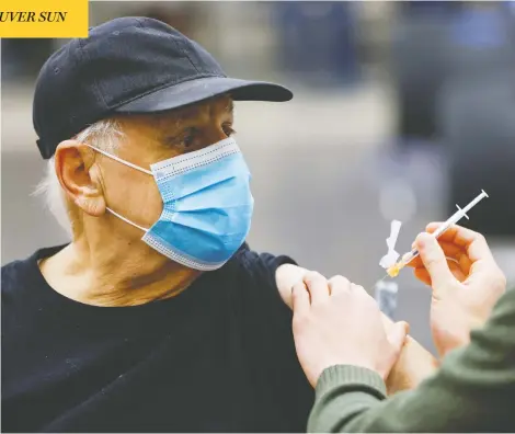  ?? BLAIR GABLE / REUTERS ?? A patient receives a COVID-19 vaccine at an Ottawa clinic Tuesday, as inoculatio­n efforts continue to help slow the spread of the coronaviru­s.