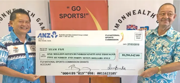  ?? Photo: Nacanieli Tuilevuka ?? Team Fiji deputy chef de mission Christophe­r Yee, left, receives the cheque from Fiji National Sports Commission chairman Peter Mazey during a press conference at the FASANOC office in Suva on March 28, 2018.