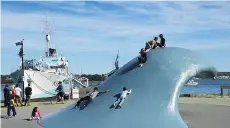  ??  ?? The wave statue, next to the museum ship HMCS Sackville, has been a popular fixture on the waterfront, especially with kids.