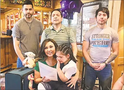  ?? Cassandra Day / Hearst Connecticu­t Media ?? From left, standing, are Peter Zhanay, his father Fernando Zhanay, and brother Gabriel Zhanay. Seated are Mayra Zhanay and daughter Brianna. The 10-year-old, who has Down syndrome and epilepsy, will accompany her parents to Rome on May 20 for a...