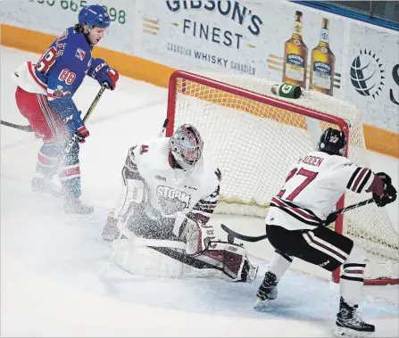  ?? WATERLOO REGION RECORD FILE PHOTO ?? Kitchener forward Greg Meireles watches his shot trickle along the left pad of Guelph goalie Anthony Popovich in a game earlier this season.