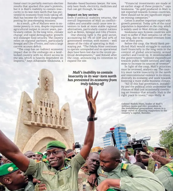  ??  ?? Colonel Malick Diaw, leader of Mali’s military junta and vice-president in the transition­al government, waves to a large crowd of cheering supporters in the country’s capital, Bamako.