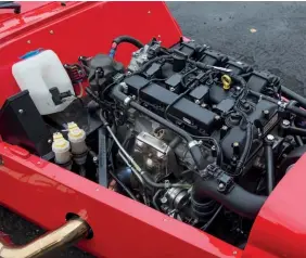  ??  ?? Bonnet unclips easily to reveal a no-nonsense engine bay that’s home to Ford’s turbocharg­ed 2.0-litre four-cylinder Ecoboost engine.