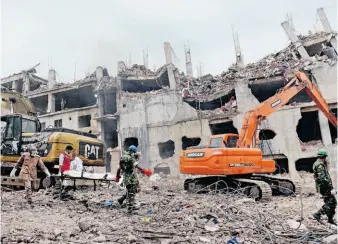  ?? Ismail Ferdous / Associated Press ?? The collapse of a garment factory in Bangladesh in April has claimed the lives of more than 1,100 garment workers, and appears to be leading to sweeping reforms among world retailers.